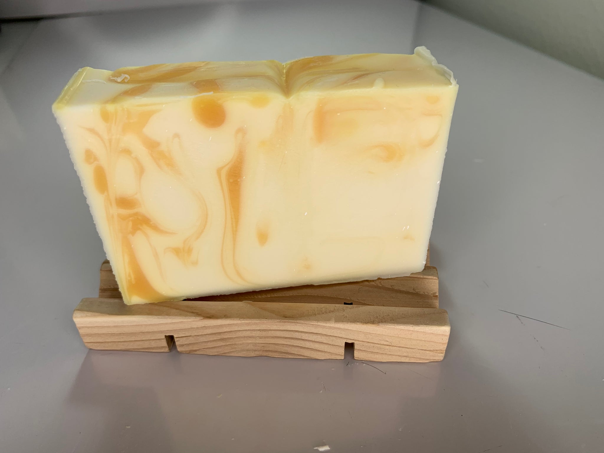 Cedar Soap Dish shown with a bar of our Citrus & Peppermint Organic Soap